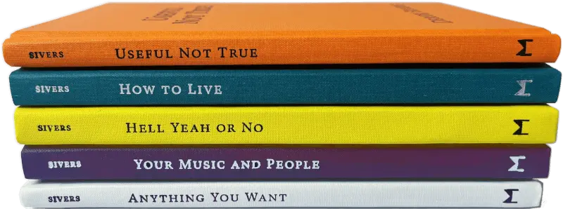 stack of four hardcover books by Derek Sivers